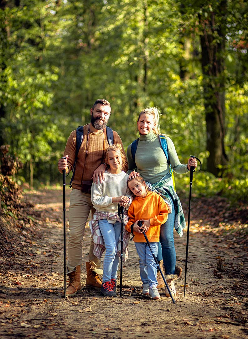 portrait-of-smiling-family-of-four-exploring-natur-2023-11-30-21-00-35-GUDWBYC.jpg